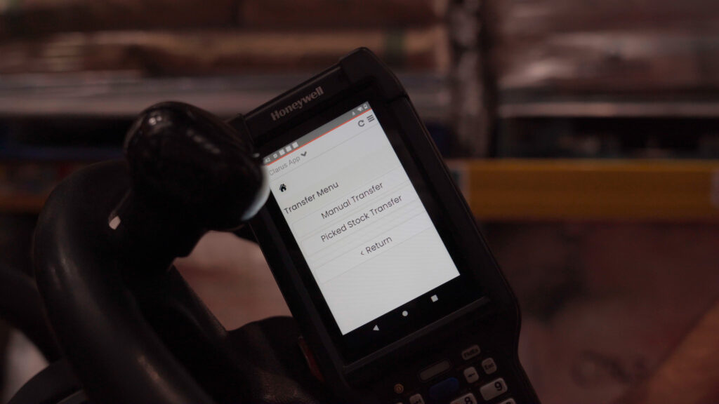 Handheld | clarus wms Honeywell handheld scanner showing the clarus wms transfer menu, mounted on a forklift